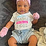 Ryleigh is registered to the contest to win money with this photo: accessories, baby, bodypart, clothing, face, finger, glove, hand, happy, hat, head, hosiery, pants, person, photography, portrait, shorts, sitting, sock, t_shirt