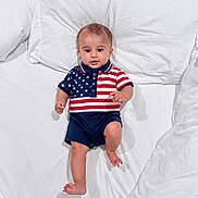 Mashfee joined the competition — help win amazing prizes! baby, bed, child, clothing, cute, feet, happy, head, indoors, infant, pajamas, patriotic, person, portrait, skin, sleepwear, smiling, stars, stripes, white_bed