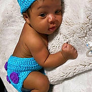 Day'Tone is registered to the contest to win money with this photo: baby, infant, crochet, blue_hat, blue_diaper, blue_booties, monster_costume, blanket, soft_texture, cute, lying_down, face, expression, handmade, knitted, child, adorable, indoors, portrait, sleepy