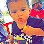 Orlando joined the competition — help win amazing prizes! toddler, child, party_hat, emoji, curly_hair, black_shirt, outdoor, adult, hat, tongue_out, hand, yellow_object, cone, red_rail, vehicle, trees, sunny, people, casual_clothing, portrait