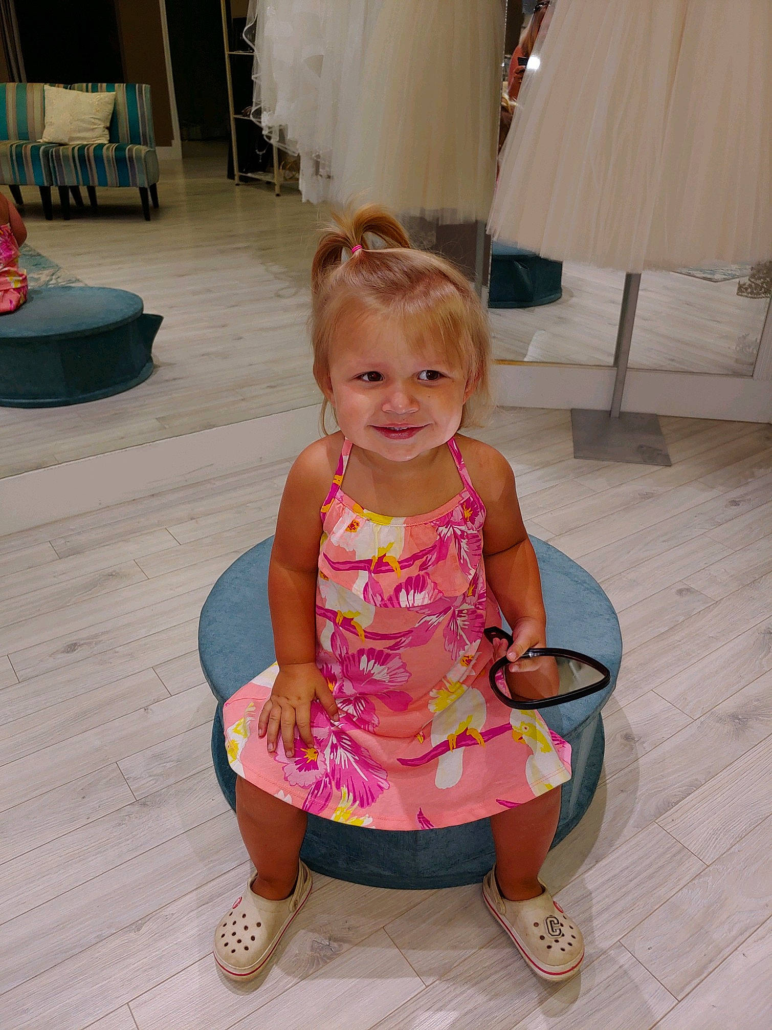 Carsyn is registered to the contest to win money with this photo: chair, child, floor, flooring, furniture, joy, leg, magenta, person, pink, sitting, toddler