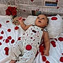 Elias joined the competition — help win amazing prizes! baby, infant, rose_petals, roses, red_petals, white_blanket, pillow, overalls, newspaper_backdrop, heart_drawings, bouquet, portrait, lying_down, hand, feet, cute, staged_photo, photography, celebration, gaze_upwards