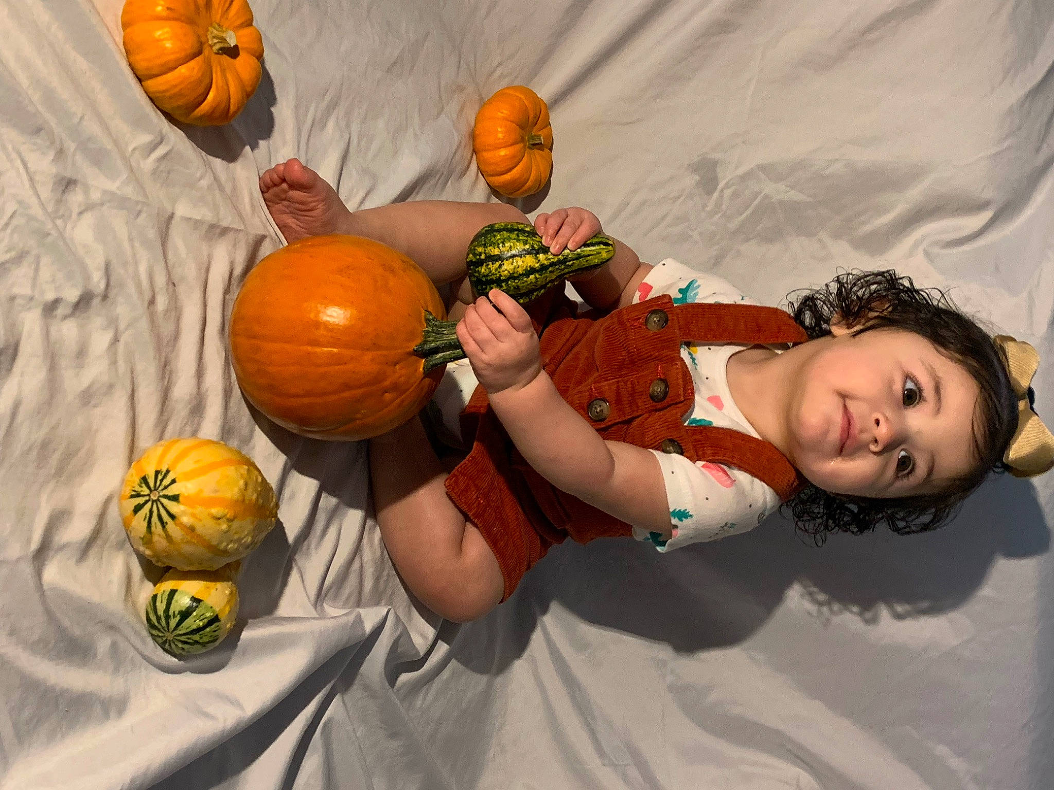 Ellie Bea is registered to the contest to win money with this photo: art, calabaza, cucurbita, eye, facial_expression, fruit, fun, gourd, happy, human_body, local_food, natural_foods, orange, person, plant, pumpkin, squash, toddler, tree, vegetable