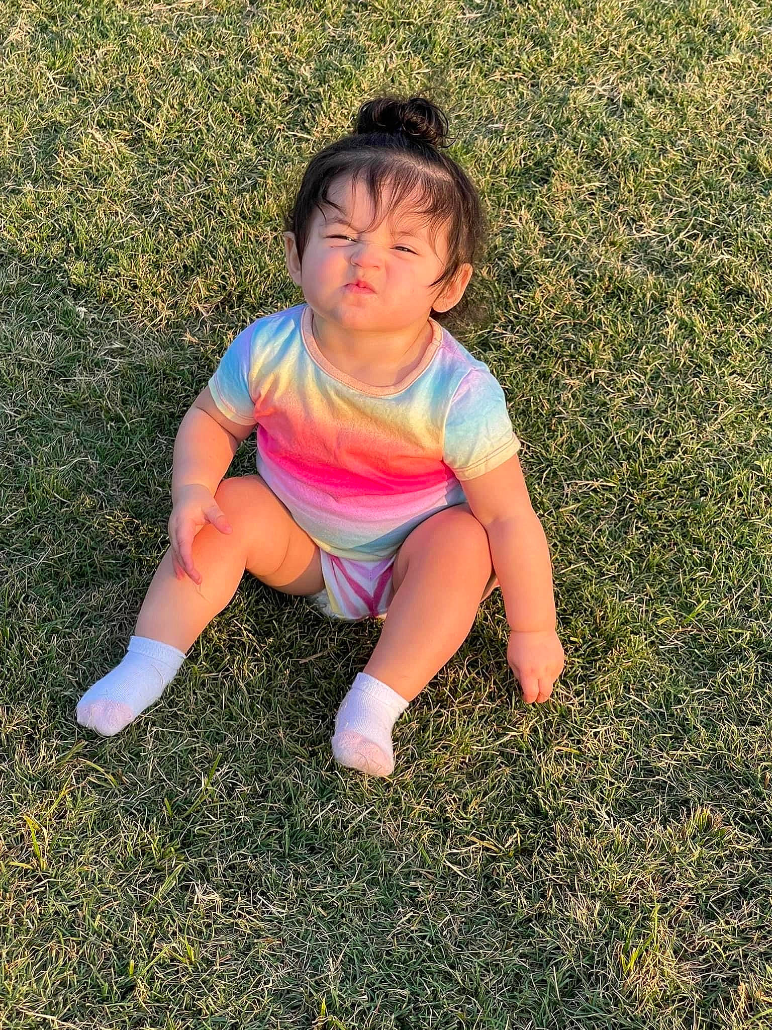 Ellie Bea is registered to the contest to win money with this photo: asphalt, baby_toddler_clothing, face, flash_photography, fun, grass, grass_family, grassland, happy, human_leg, lawn, leaf, leg, meadow, people_in_nature, person, sunlight, t_shirt, thigh, tints_and_shades