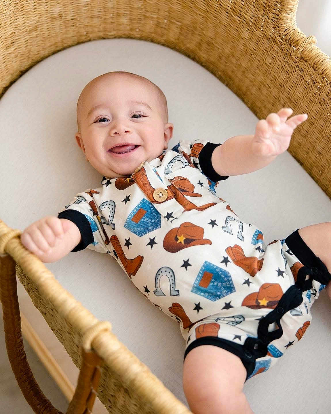 Bailor joined the competition — help win amazing prizes! baby, infant, smiling, basket, bassinet, cowboy_outfit, onesie, happy, cute, reaching_out, woven_furniture, indoor, child, portrait, clothing, newborn, playful, skin, face, cute_expression
