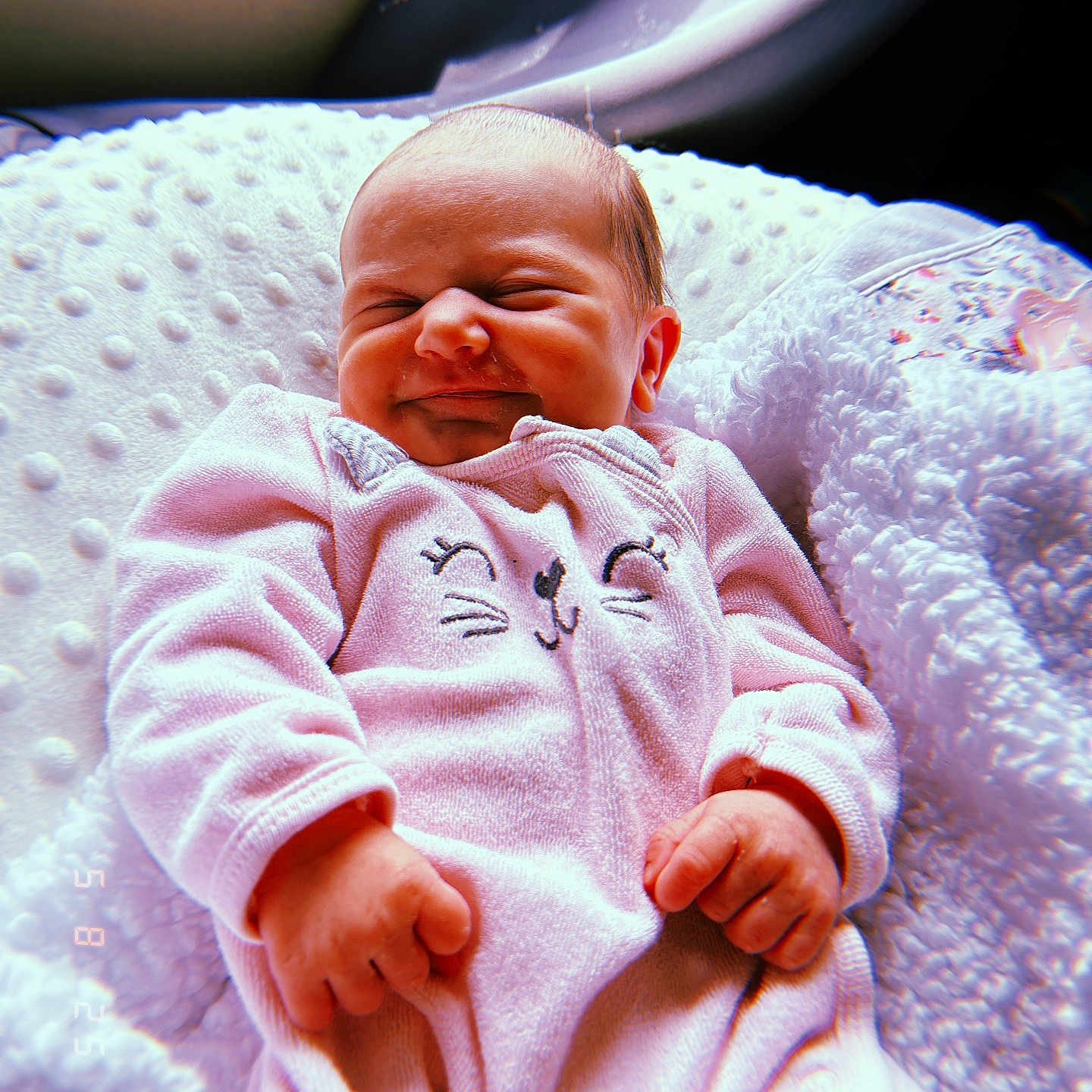 Eliana joined the competition — help win amazing prizes! baby, blanket, child, clothing, comfort, cozy, cute, cute_expression, face, hands, indoor, infant, newborn, person, pink_onesie, portrait, resting, sleepy, soft_texture, warm