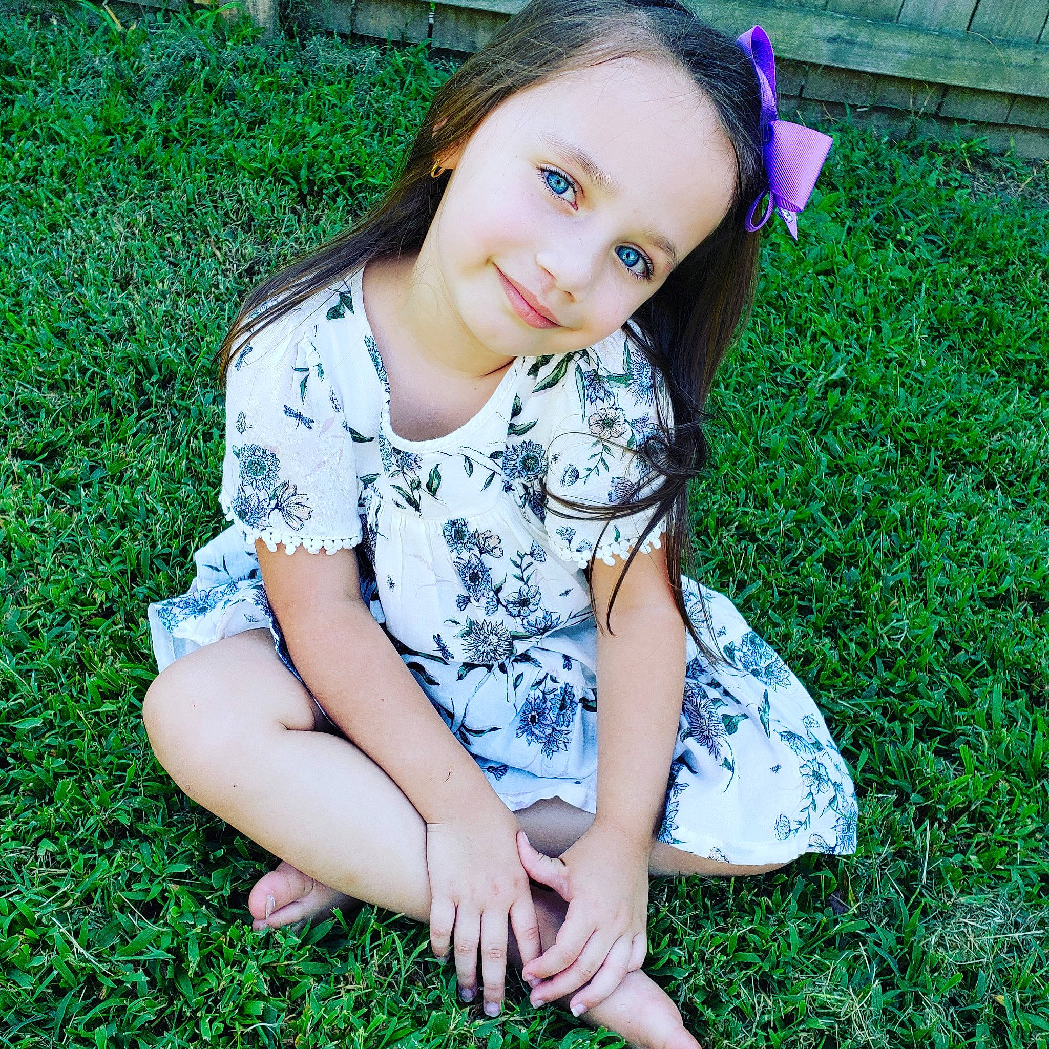 Heidi is registered to the contest to win money with this photo: beauty, child, child_model, dress, eye, face, grass, grass_family, green, hair, head, joy, leg, long_hair, person, photography, plant, sitting, skin, smile