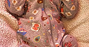 Lilly is registered to the contest to win money with this photo: baby, sleeping, infant, portrait, onesie, jumpsuit, blanket, cozy, nursery, indoors, face, head, closed_eyes, peaceful, lying_down, textile, soft, patterned_clothing, warm, baby_bedding