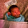 Lilly is registered to the contest to win money with this photo: newborn, baby, infant, sleeping, smiling, face, portrait, blanket, swaddled, blue_blanket, pink_blanket, cozy, bed, textile, fabric_sign, indoor, close_up, cute, peaceful, hands