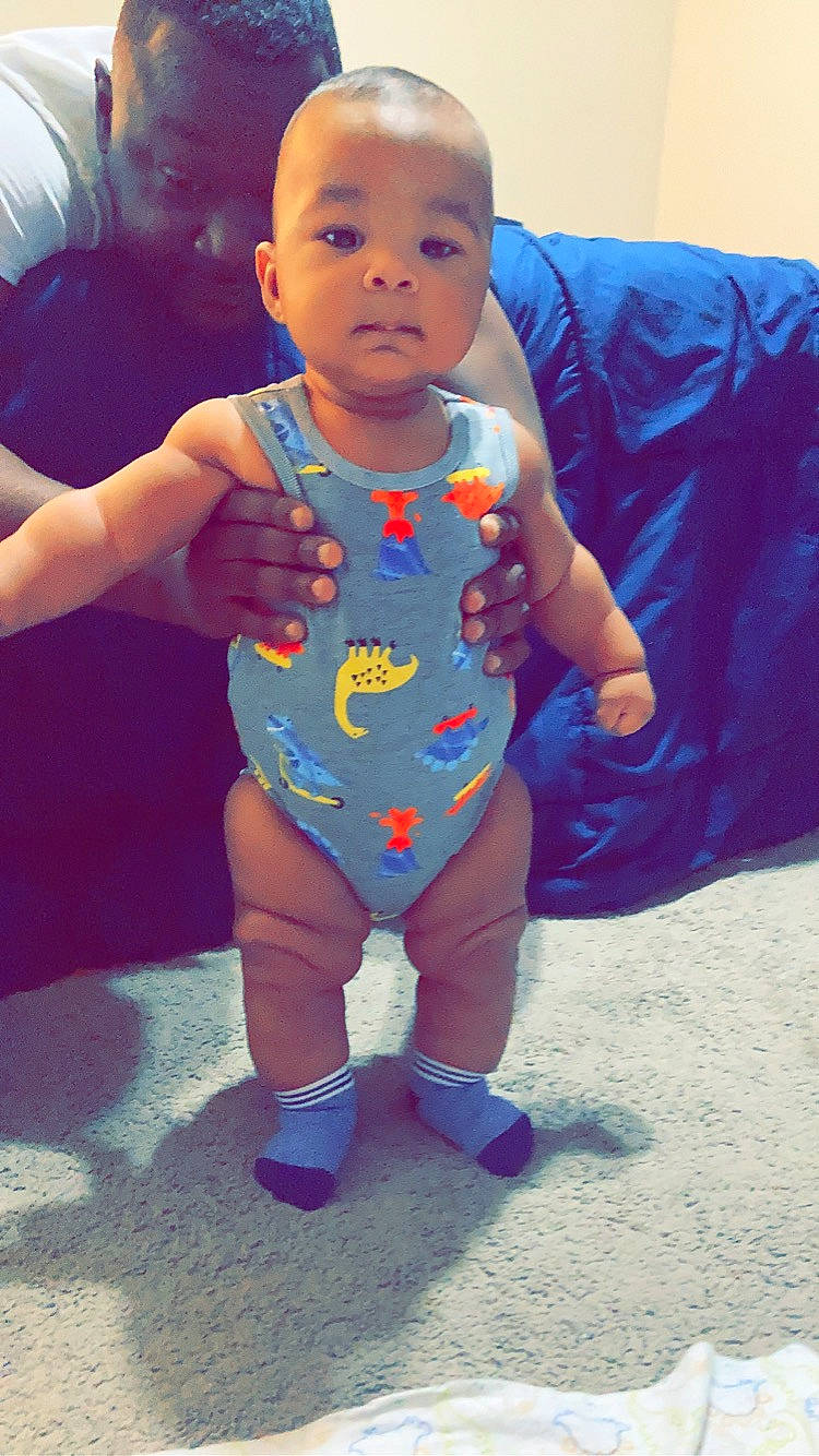 Kanan is registered to the contest to win money with this photo: baby, baby_toddler_clothing, child, electric_blue, eye, face, flooring, fun, happy, head, human_leg, leg, mouth, nose, person, skin, sleeve, smile, t_shirt, thigh