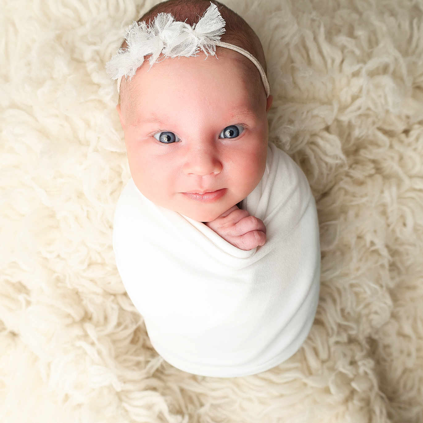 Miller Grace joined the competition — help win amazing prizes! adorable, baby, blanket, blue_eyes, child, cozy, cute, face, fluffy_rug, headband, infant, looking_up, lying_down, newborn, portrait, small_hand, soft_texture, studio_photo, swaddled, white_cloth