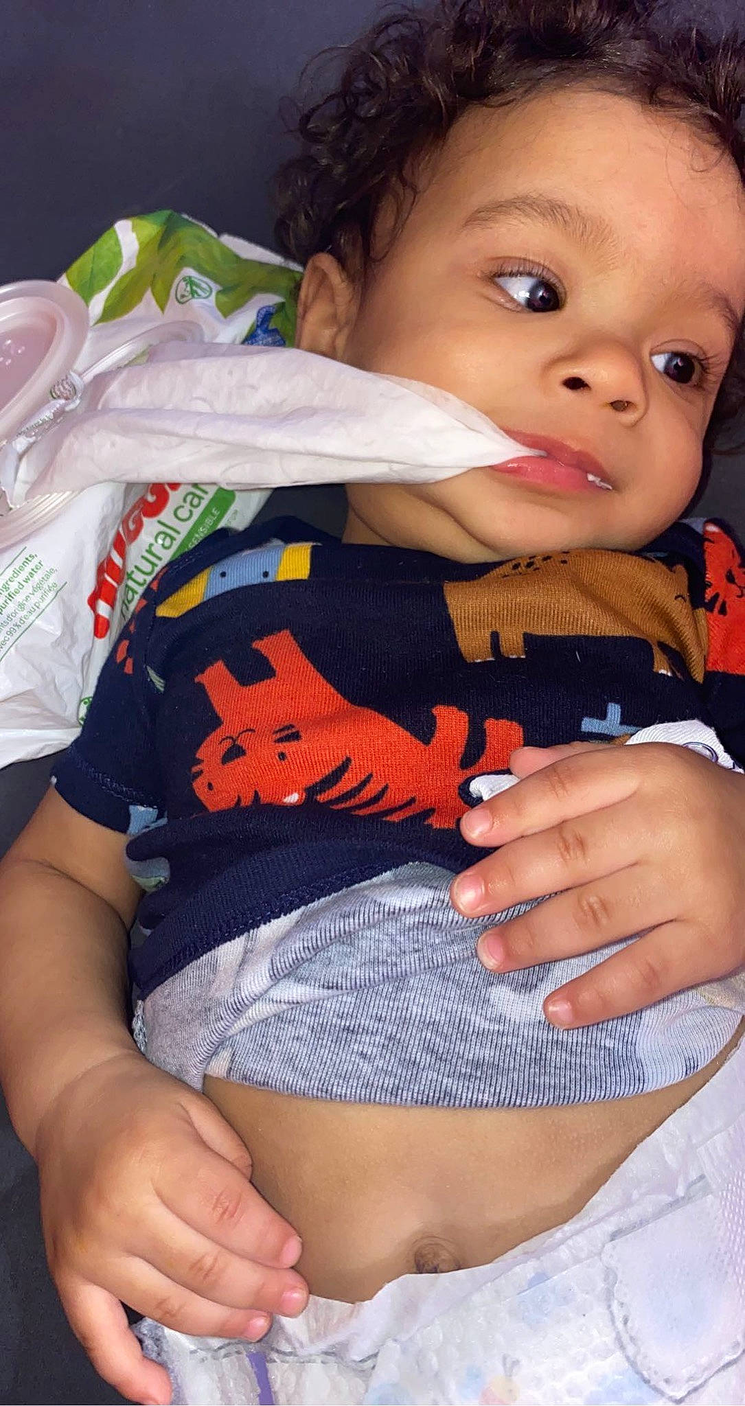 Savion is registered to the contest to win money with this photo: baby, baby_toddler_clothing, cheek, child, finger, gesture, hairstyle, hand, happy, mouth, nail, orange, person, shorts, skin, sleeve, t_shirt, thigh, thumb, toddler