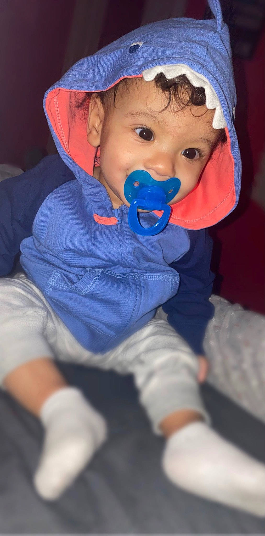 Savion is registered to the contest to win money with this photo: baby, baby_products, baby_toddler_clothing, beanie, blue, cap, cheek, child, comfort, electric_blue, fashion_accessory, fun, hat, headgear, mouth, person, sitting, skin, sleeve, sun_hat