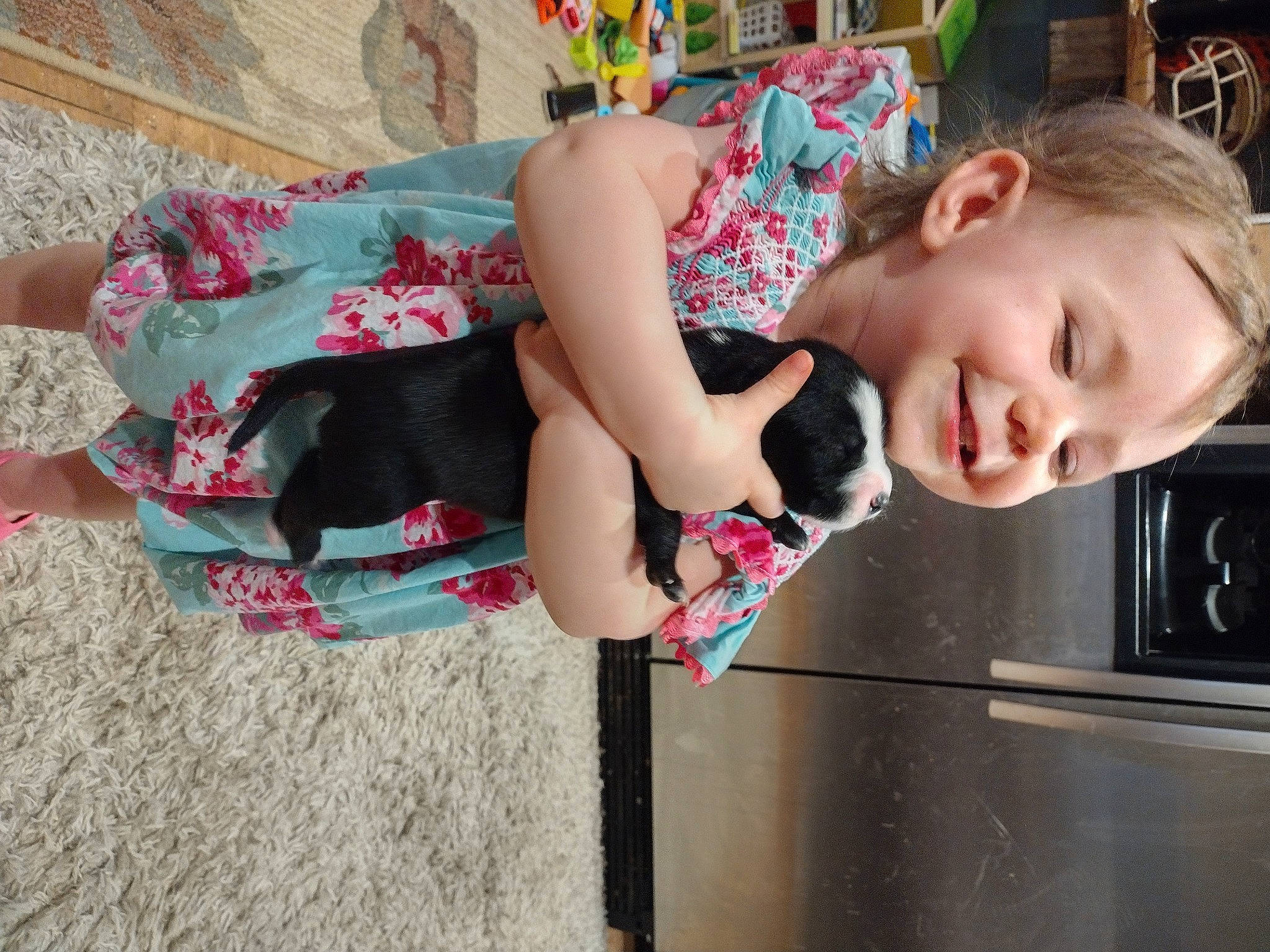 Zoey is registered to the contest to win money with this photo: child, dress, fun, happy, human_leg, joy, leisure, magenta, pattern, person, pink, play, sitting, smile, street_fashion, thigh, toddler, tree, vacation, vehicle_door