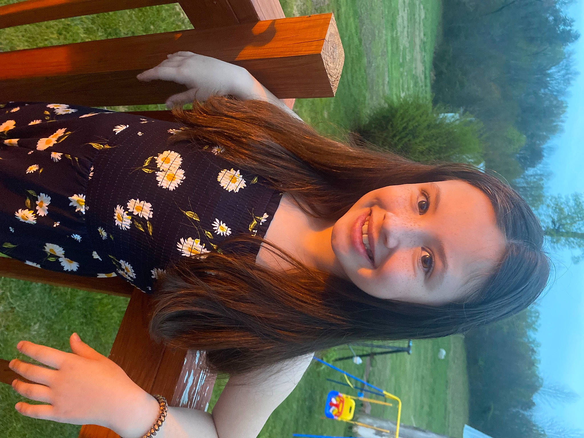 Aubree joined the competition — help win amazing prizes! black_hair, brown_hair, fun, grass, green, hair, happy, human_body, human_leg, joy, leisure, long_hair, orange, pattern, people_in_nature, person, plant, smile, thigh, tree