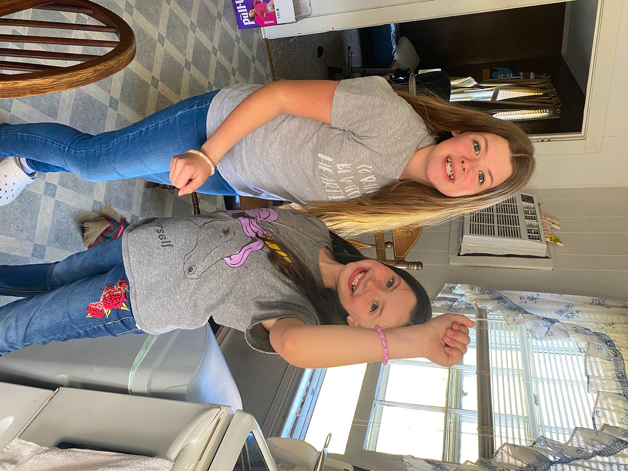 Aubree is registered to the contest to win money with this photo: arm, building, clothing, comfort, fun, home_appliance, human_body, human_leg, joint, joy, knee, lap, leg, mechanical_fan, organ, person, shelf, shoe, smile, suit