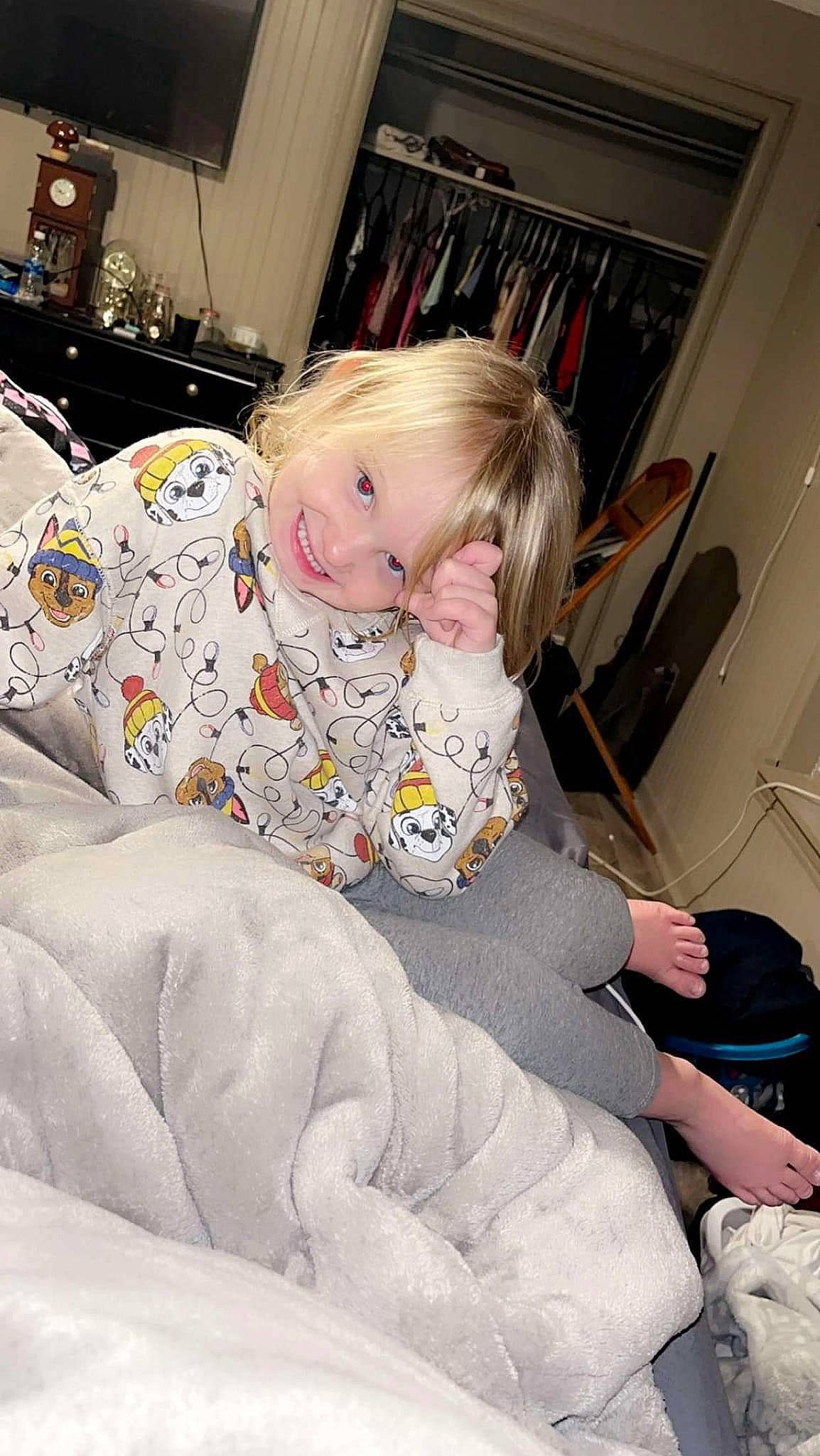 Melanie is registered to the contest to win money with this photo: baby, baby_toddler_clothing, child, comfort, flooring, fun, home_appliance, human_leg, joy, knee, lap, linens, living_room, nap, person, picture_frame, play, room, sitting, sock