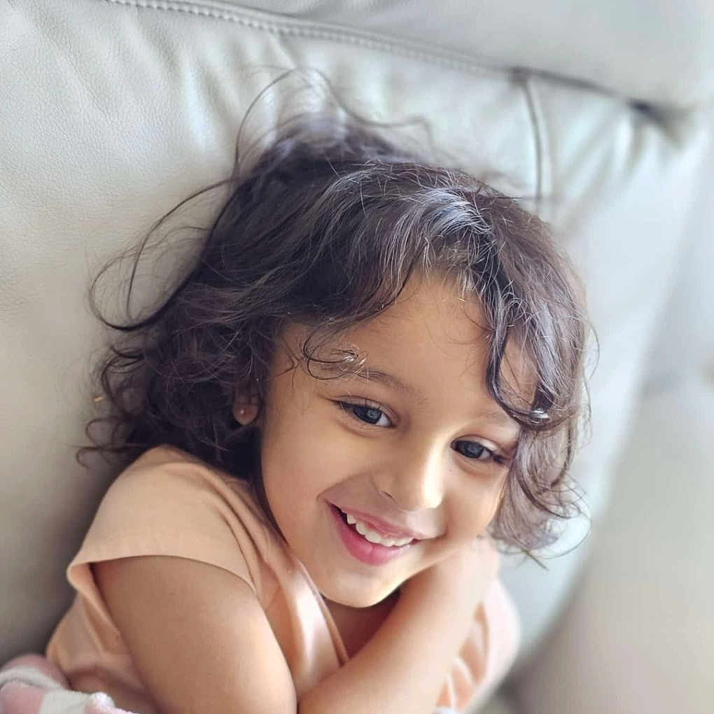 Jiya joined the competition — help win amazing prizes! bodypart, child, cushion, electronics, face, female, finger, girl, hand, happy, head, homedecor, laughing, mouth, person, phone, photography, portrait, smile, teeth