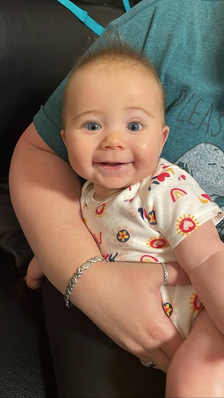 Angelina is registered to the contest to win money with this photo: baby, baby_toddler_clothing, cheek, chin, eye, eyebrow, face, flash_photography, happy, head, human_body, iris, joy, lip, mouth, muscle, neck, nose, person, skin