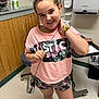 Takeila joined the competition — help win amazing prizes! child, girl, smiling, pink_clothing, headband, scrunchie, purse, indoor, medical_room, hand_sanitizer, wall_paneling, floor_tiles, chair, table, trash_can, paper_towel_dispenser, casual_wear, shorts, footwear, portrait