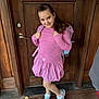Takeila joined the competition — help win amazing prizes! child, girl, smiling, pink_clothing, backpack, sneakers, wooden_door, standing, long_hair, casual_wear, portrait, happy, outdoor, feet, floor, wood, playful, person, fashion, posing