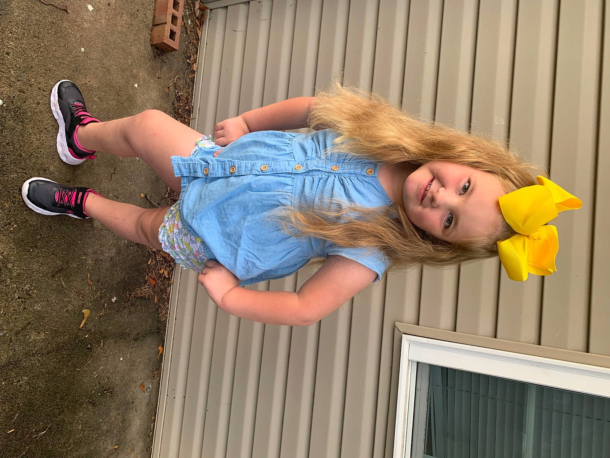 Payzleigh is registered to the contest to win money with this photo: calf, child, denim, electric_blue, face, foot, fun, hair, happy, human_leg, jean_short, joy, knee, leisure, person, sandal, sitting, t_shirt, thigh, waist