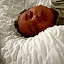 Issa participe au concours pour gagner de l'argent avec cette photo : child, sleeping, blanket, bed, face, cozy, rest, nap, soft, texture, indoors, peaceful, person, comfort, young, pillow, relax, home, portrait, quiet