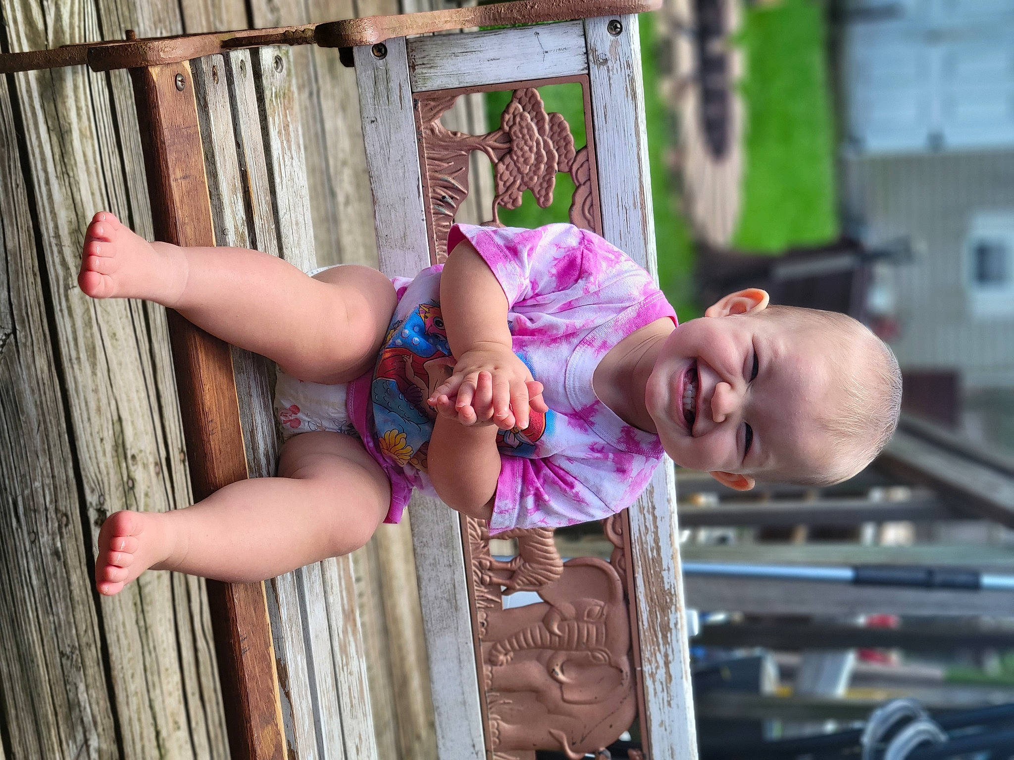Harper joined the competition — help win amazing prizes! baby, baby_toddler_clothing, child, chin, fun, grass, happy, human_leg, joy, leisure, magenta, person, pink, play, sitting, skin, smile, t_shirt, temple, thigh