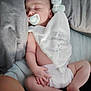baby, sleeping, pacifier, blanket, plush_toy, diaper, pillow, bed, infant, soft_toy, rest, child, cute, relaxation, cozy, nap, peaceful, skin, hand, foot