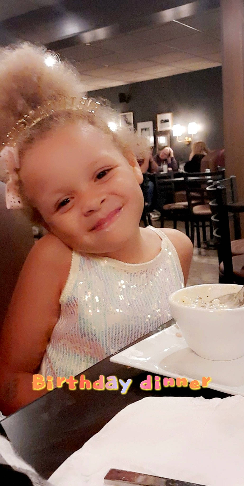 Norah is registered to the contest to win money with this photo: baby, baby_toddler_clothing, beauty, blurred, chair, child, drinkware, event, face, flash_photography, fun, happy, headband, headpiece, jewellery, joy, organ, person, skin, smile