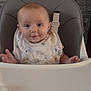 Emmylou is registered to the contest to win money with this photo: baby, background, bib, child, clothing, cute, drool, expression, face, feeding, furniture, happy, head, high_chair, indoor, infant, person, seat, smile, young