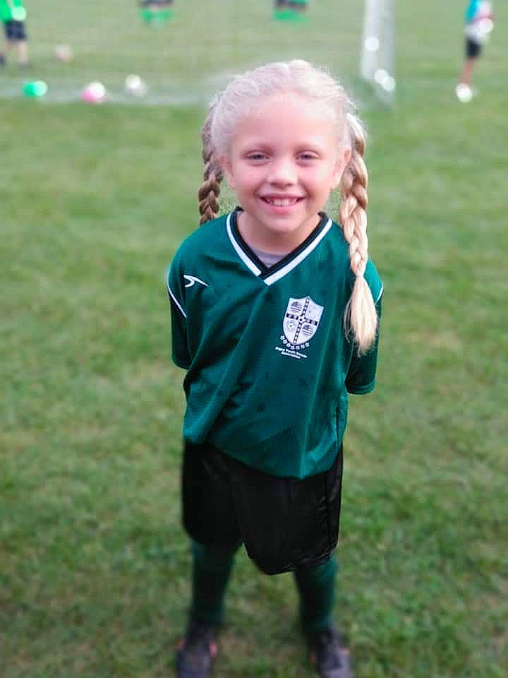 Mercedez is registered to the contest to win money with this photo: boy, child, competition, competition_event, day, fun, girl, grass, green, joy, outerwear, person, plant, play, player, recreation, smile, sports, team, team_sport
