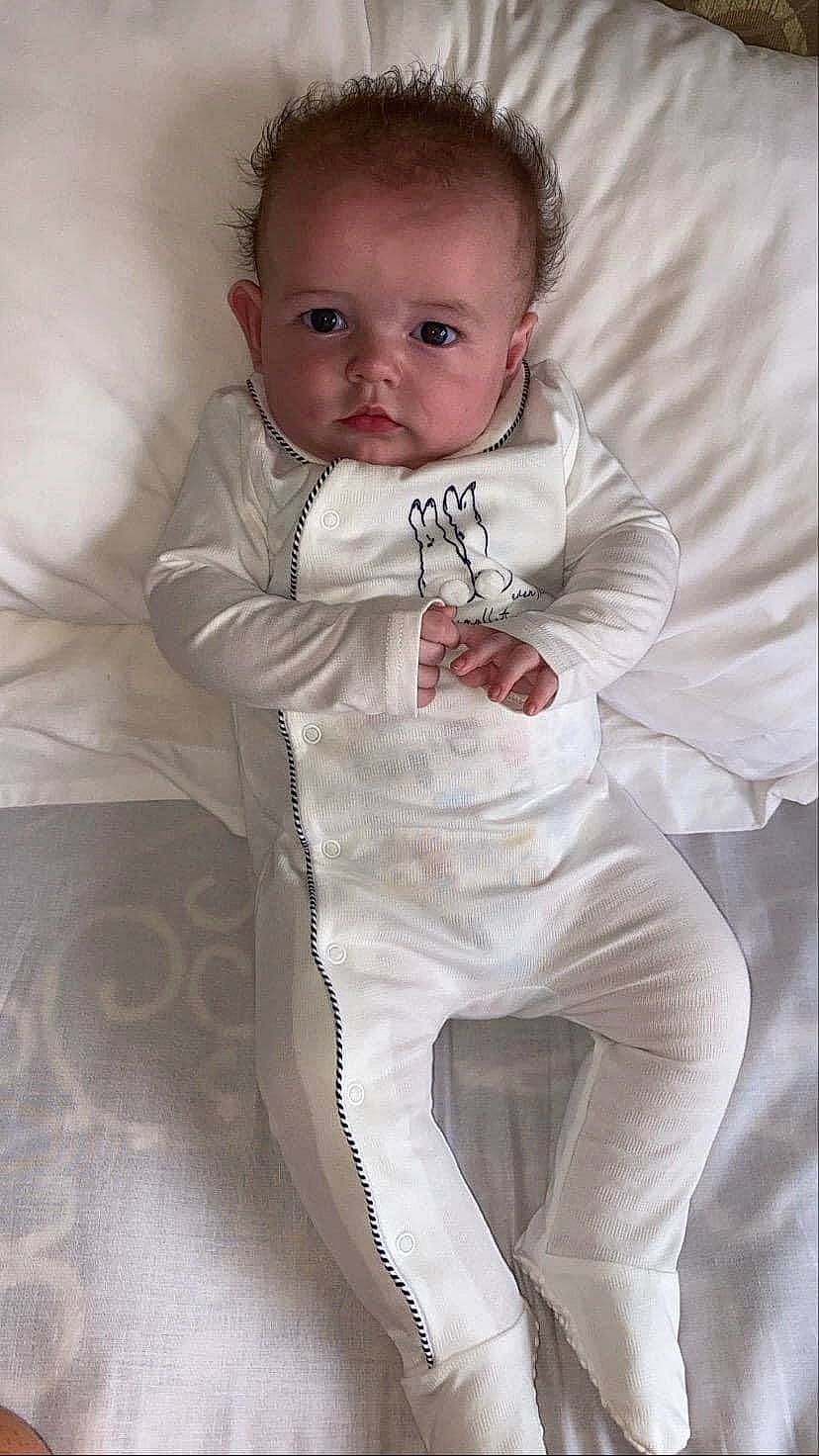 Douglas is registered to the contest to win money with this photo: abdomen, arm, baby, baby_products, baby_toddler_clothing, cheek, child, leg, person, product, skin, sleeve, smile, toddler, white