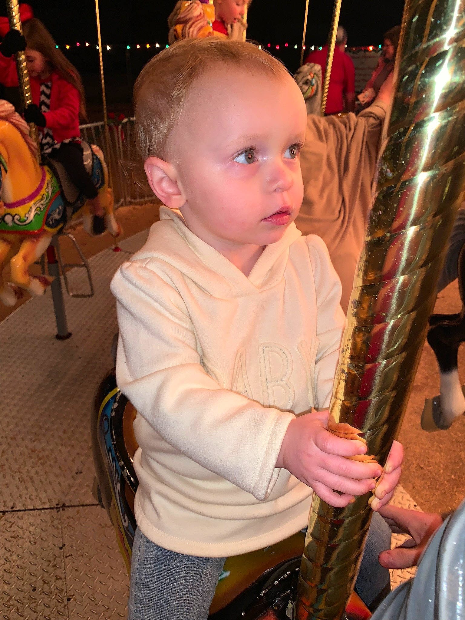 Elizabeth is registered to the contest to win money with this photo: baby, child, city, event, fun, headwear, holiday, leisure, organ, person, photograph, pink, recreation, rope, sitting, snapshot, standing, swing, toddler, vacation