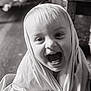 toddler, child, smiling, laughing, face, portrait, indoor, cloth, wrapped, happy, baby, cute, hand, ring, head_covering, black_and_white, close_up, expression, person, joy