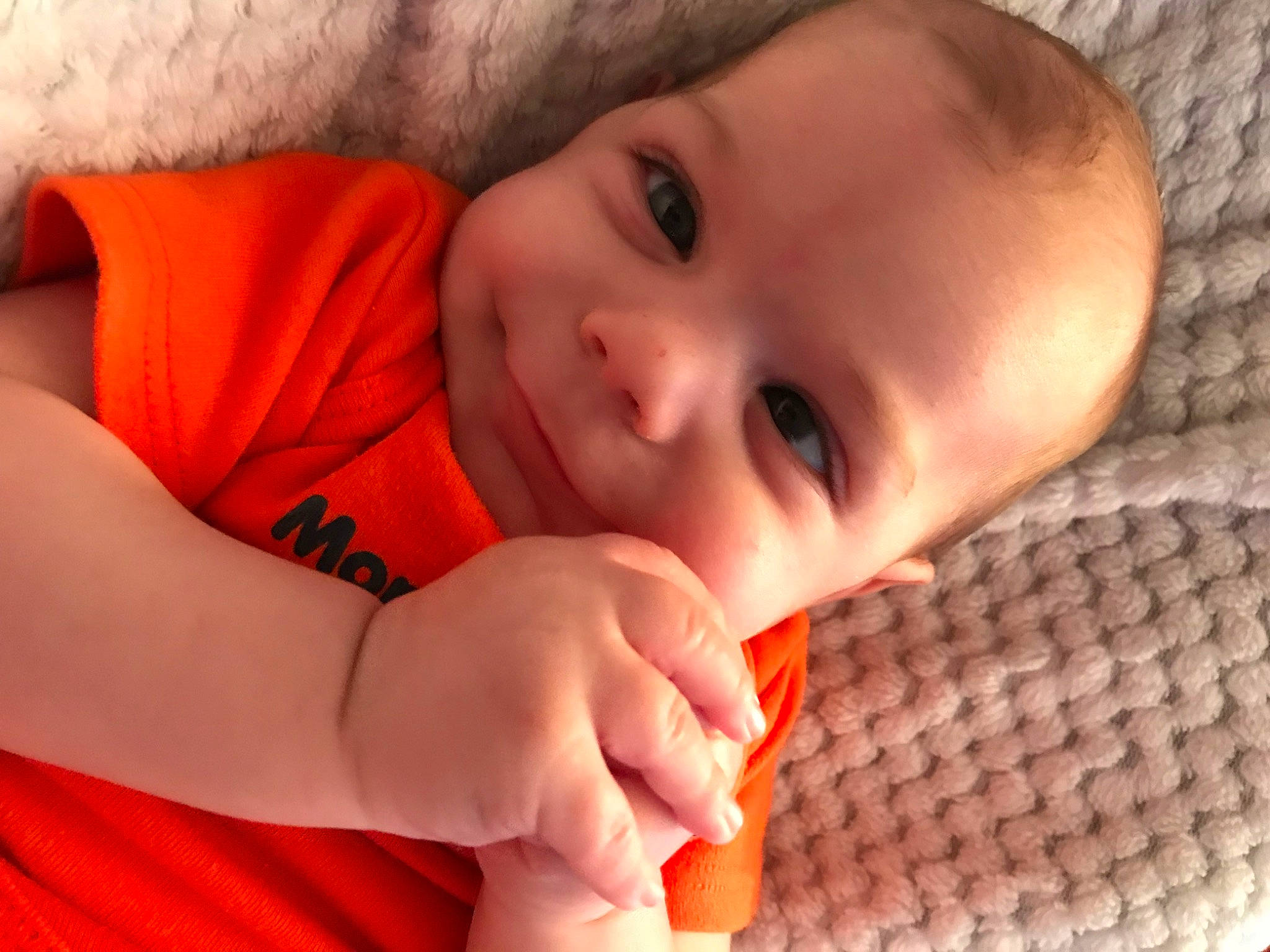 Laken is registered to the contest to win money with this photo: arm, cheek, chin, comfort, eye, eyebrow, eyelash, finger, gesture, hand, head, human_body, iris, lip, mouth, neck, nose, orange, person, skin