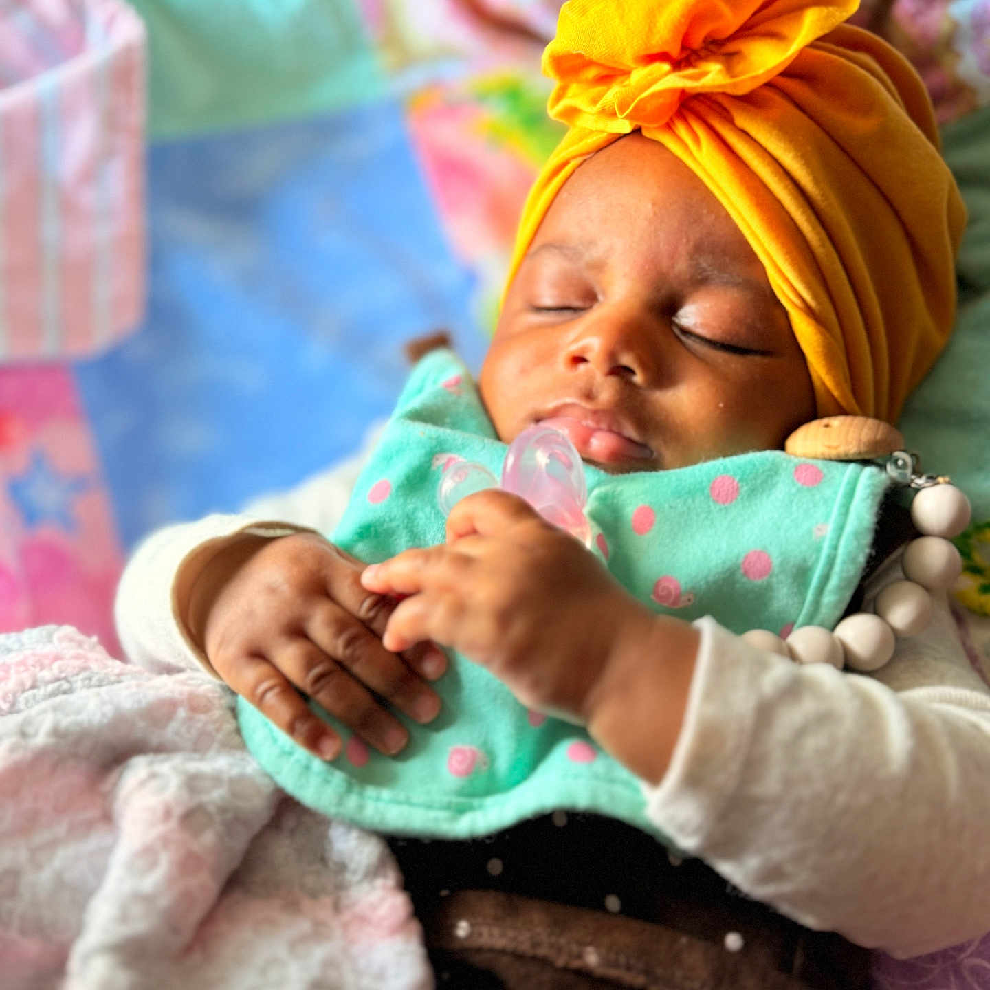 Cherishe is registered to the contest to win money with this photo: baby, blanket, bodypart, bonnet, clothing, face, finger, flower, glove, hand, hat, head, newborn, person, photography, plant, portrait, rose, sleeping, turban