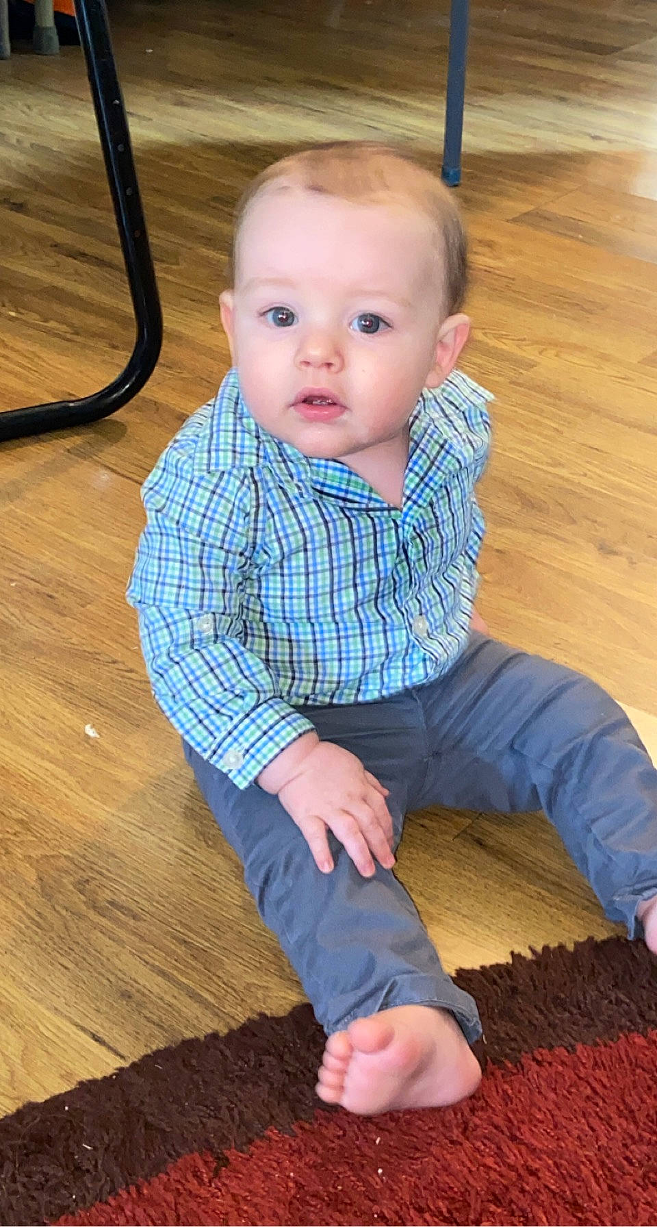 Beaux is registered to the contest to win money with this photo: arm, baby_toddler_clothing, cheek, chin, collar, face, finger, floor, flooring, hardwood, human_body, joint, leg, neck, nose, person, shoulder, skin, sleeve, toddler