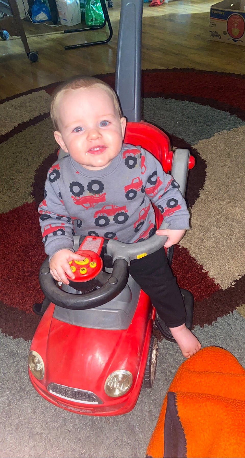 Beaux joined the competition — help win amazing prizes! automotive_design, automotive_lighting, baby, baby_toddler_clothing, child, fender, flooring, fun, happy, headlamp, motor_vehicle, person, play, riding_toy, sitting, smile, tire, toddler, toy, vehicle