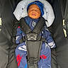 baby, blanket, blue_outfit, car_seat, child, close_up, cozy, cushion, harness, hat, indoors, infant, newborn, nike, peaceful, portrait, seated, sleeping, sportswear, stroller