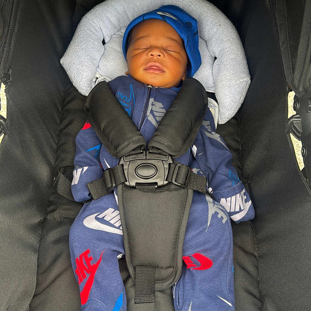 Zyquel joined the competition — help win amazing prizes! baby, blanket, blue_outfit, car_seat, child, close_up, cozy, cushion, harness, hat, indoors, infant, newborn, nike, peaceful, portrait, seated, sleeping, sportswear, stroller
