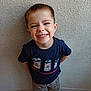 Malonn a rejoint le concours — aidez-le/la à gagner de superbes lots ! child, boy, smile, happy, standing, navy_shirt, soda_can_print, camo_pants, short_hair, indoor, wall, texture, hands_behind_back, cute, portrait, casual_clothing, young, playful, joyful, person