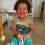 box, cabinet, child, curly_hair, cute, dress, floor, furniture, happy, indoor, pacifier, person, playful, portrait, room, shadow, smiling, sunlight, toddler, toy