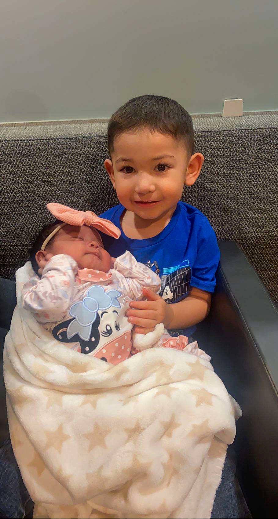 Noah joined the competition — help win amazing prizes! baby, baby_toddler_clothing, cheek, child, dress, face, finger, gesture, hair, hand, happy, head, human_body, joy, organ, person, sitting, skin, sleeve, smile