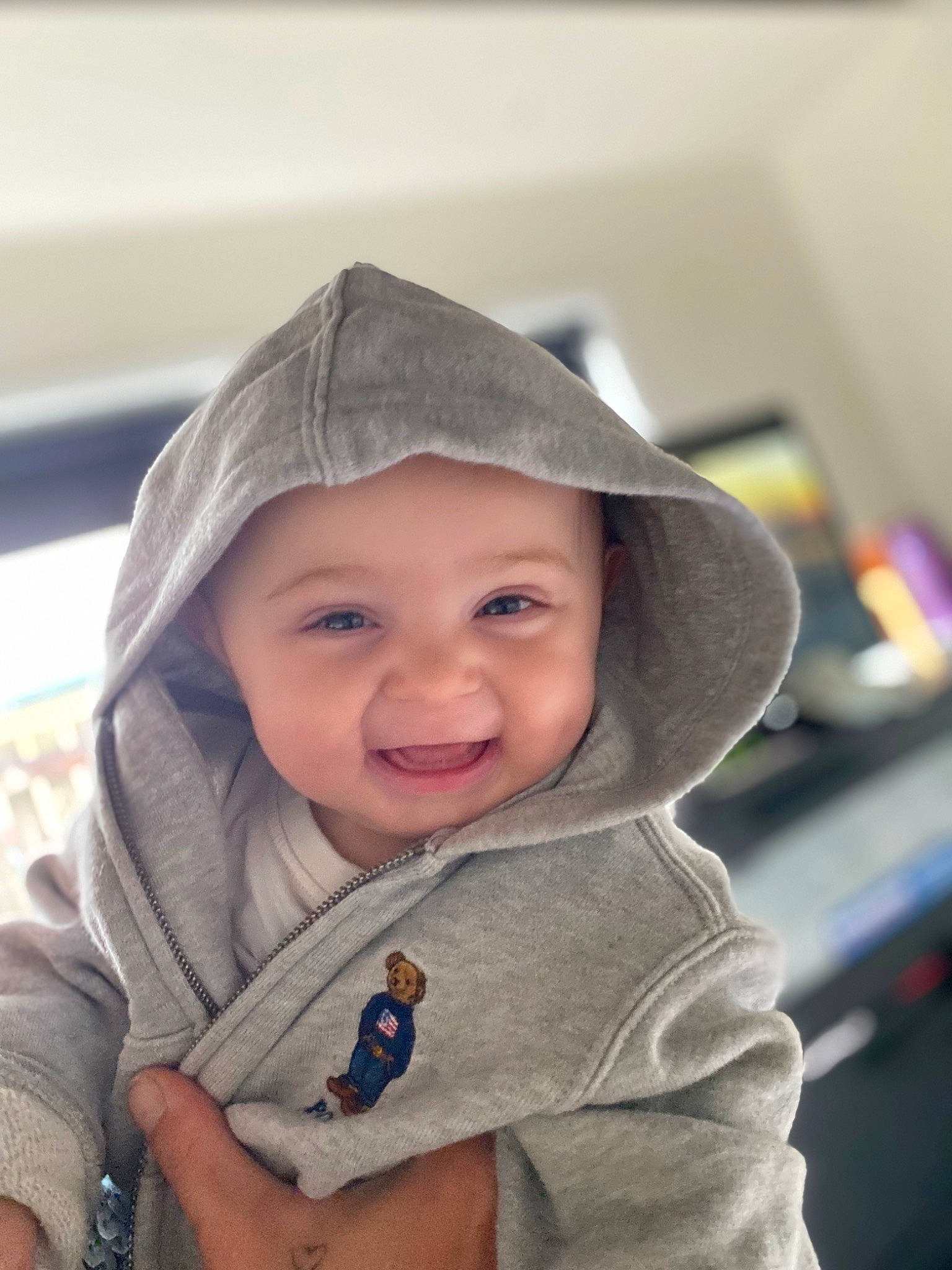 Archie joined the competition — help win amazing prizes! baby, baby_toddler_clothing, cap, cheek, child, electric_blue, eye, face, fashion_accessory, fun, happy, head, headwear, outerwear, person, product, sitting, skin, sleeve, smile