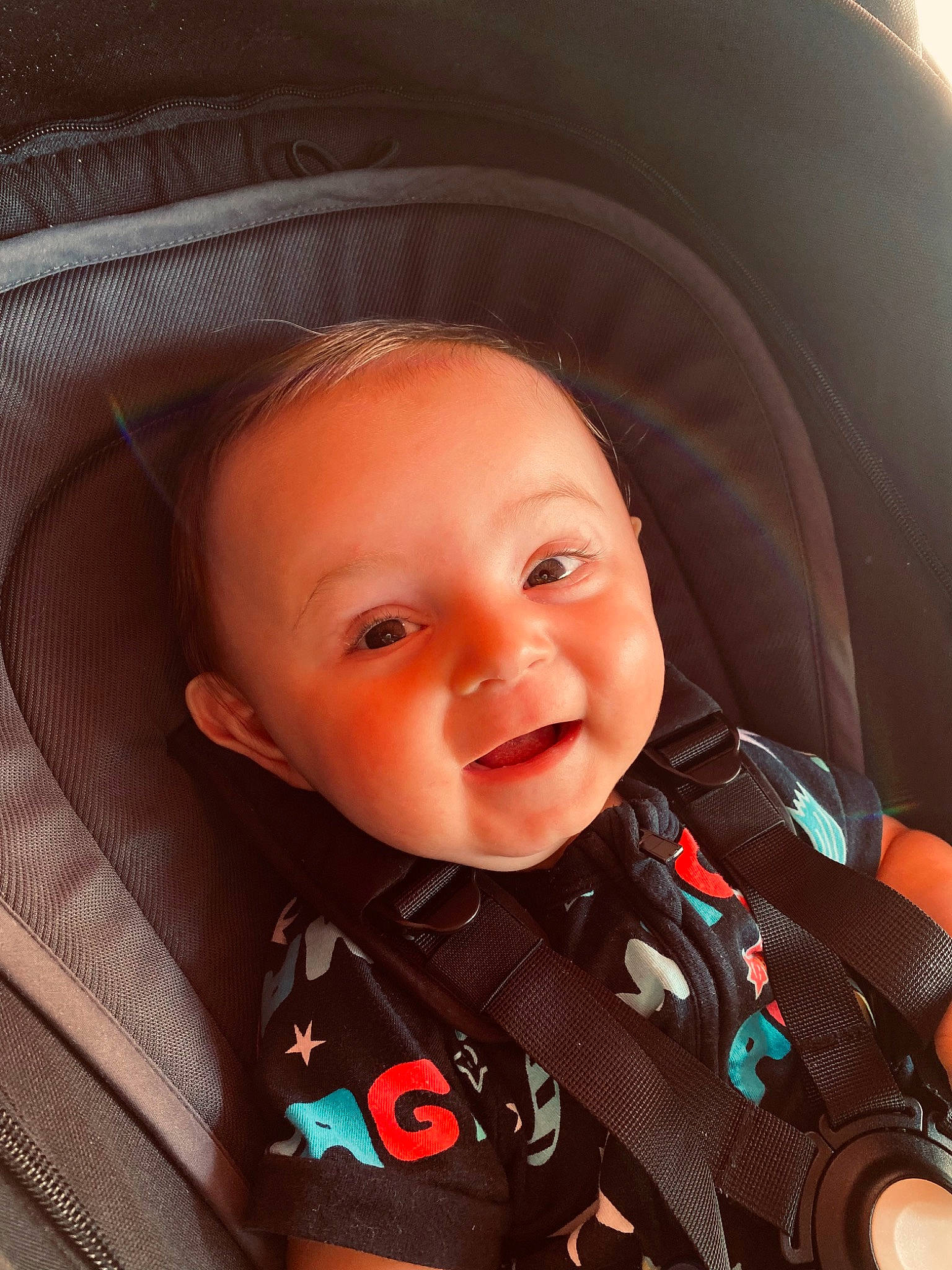 Archie is registered to the contest to win money with this photo: baby, baby_carriage, baby_toddler_clothing, car_seat, cheek, clothing, collar, comfort, eye, eyebrow, happy, iris, mouth, nose, outerwear, person, seat_belt, skin, sleeve, smile