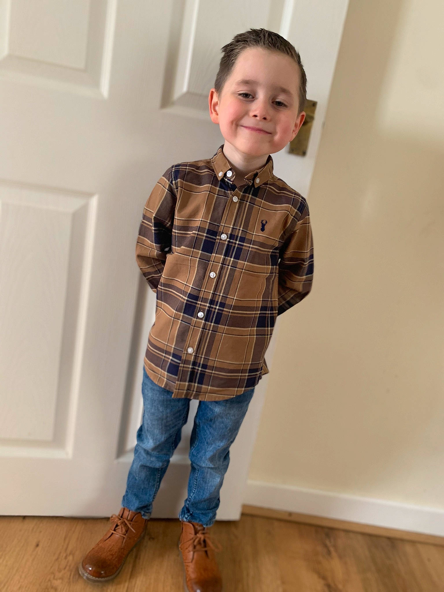 Caden joined the competition — help win amazing prizes! collar, denim, dress_shirt, face, fashion_design, floor, flooring, hair, jeans, joint, joy, neck, person, plaid, shirt, shoulder, sleeve, smile, t_shirt, tartan