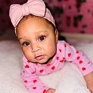 Madison joined the competition — help win amazing prizes! baby, child, infant, blue_eyes, pink_bow, headband, pink_clothing, red_hearts, blanket, soft_texture, crawling, cute, portrait, indoor, closeup, face, expression, young_child, adorable, cozy