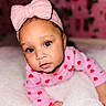 baby, child, infant, blue_eyes, pink_bow, headband, pink_clothing, red_hearts, blanket, soft_texture, crawling, cute, portrait, indoor, closeup, face, expression, young_child, adorable, cozy
