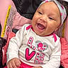 Madison is registered to the contest to win money with this photo: baby, child, smiling, happy, car_seat, headband, pink, clothing, pacifier, infant, cute, girl, apparel, joyful, portrait, seated, love, heart, fabric, expression